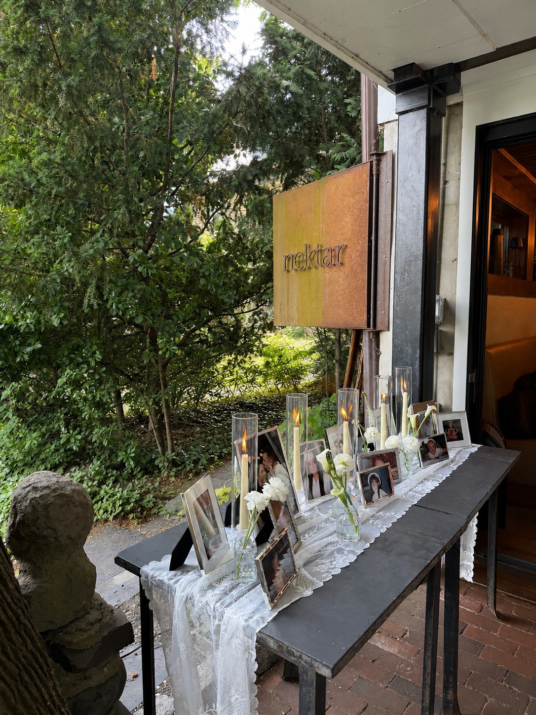 Celebration signage and florals on the patio