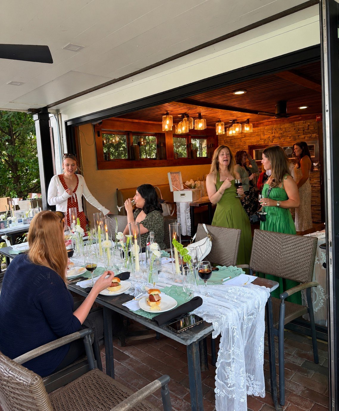 Guests mingling at a patio celebration