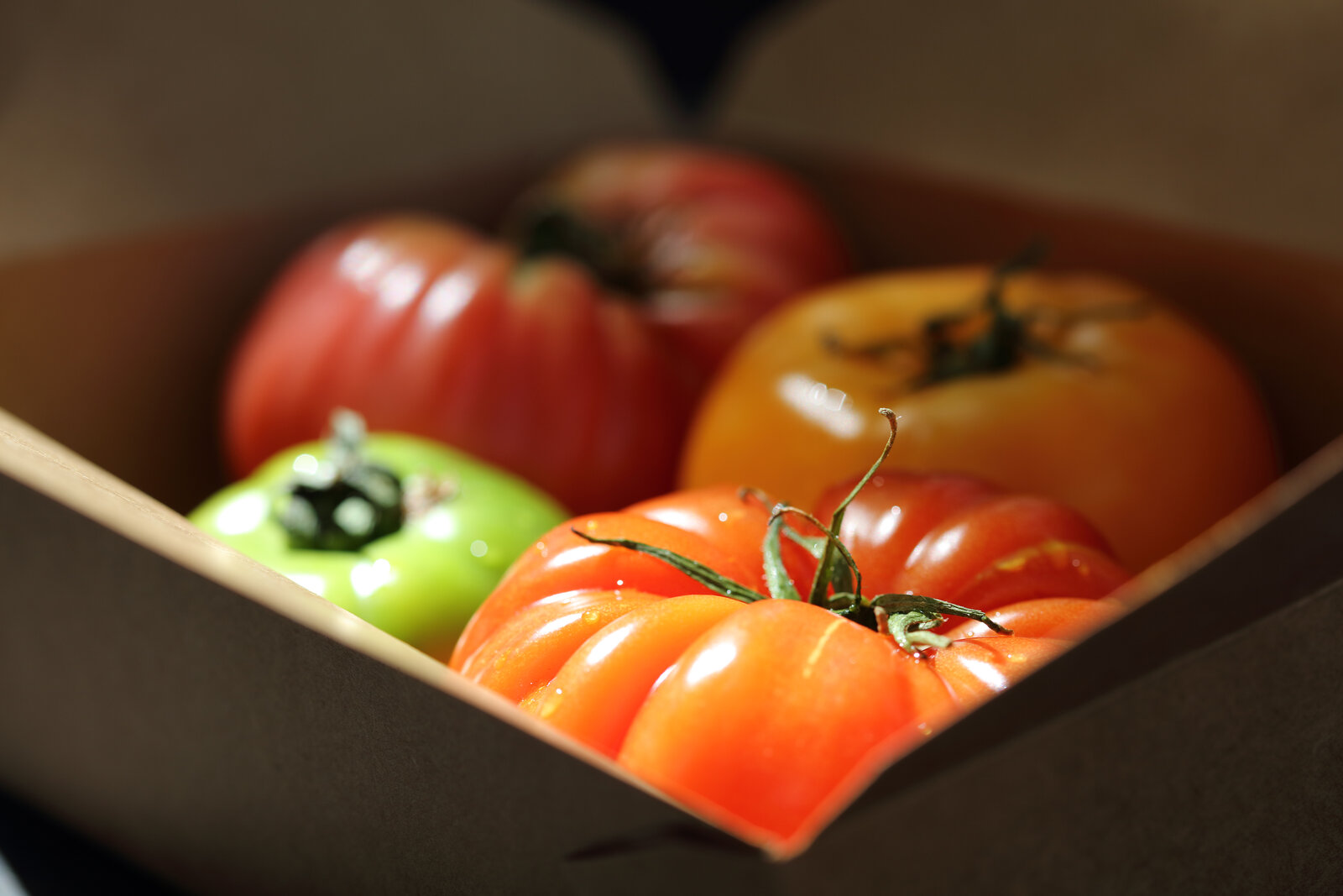 A box of heirloom tomatoes from a local farm