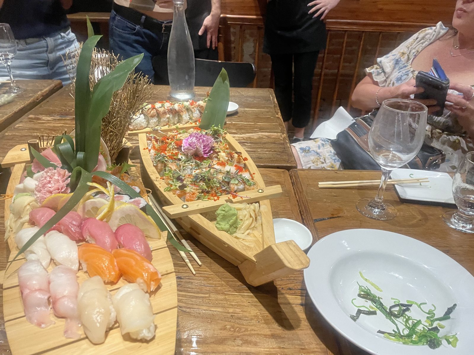 A team dinner out — sushi boats at Nuzu.